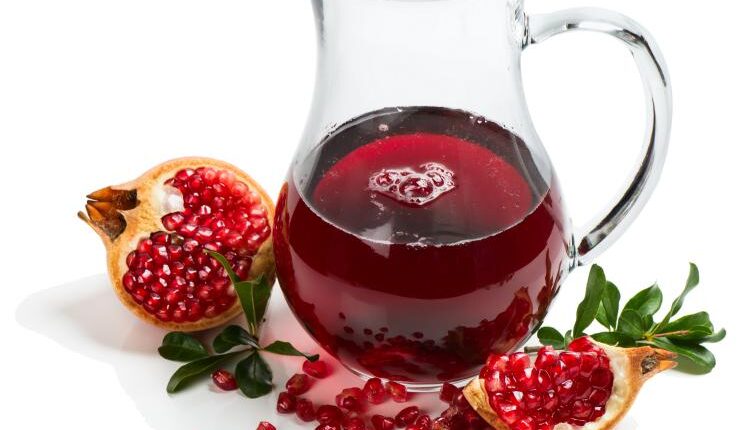 عکس استوک انار و آب انار – Grapefruit Fresh Juice Stock Photo