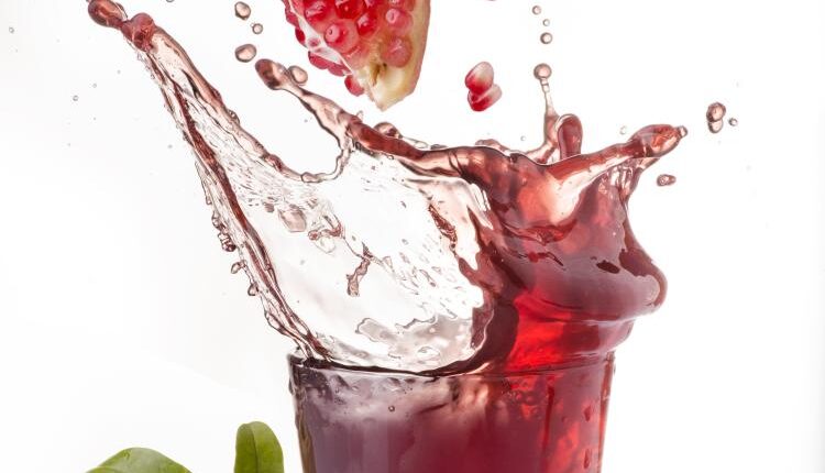 عکس استوک انار و آب انار – Grapefruit Fresh Juice Stock Photo